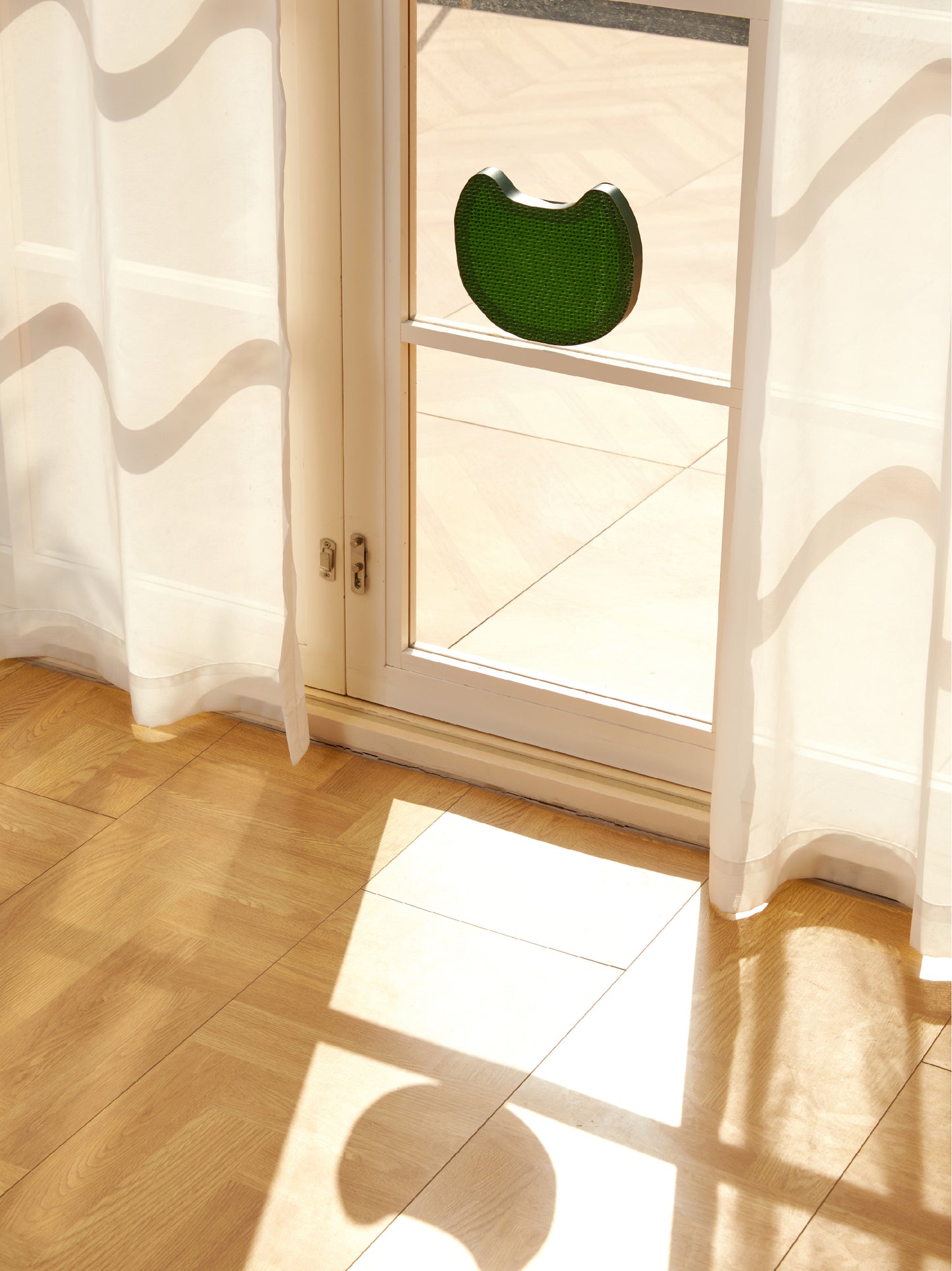 Green cat head-shaped scratching pad with included catnip packet